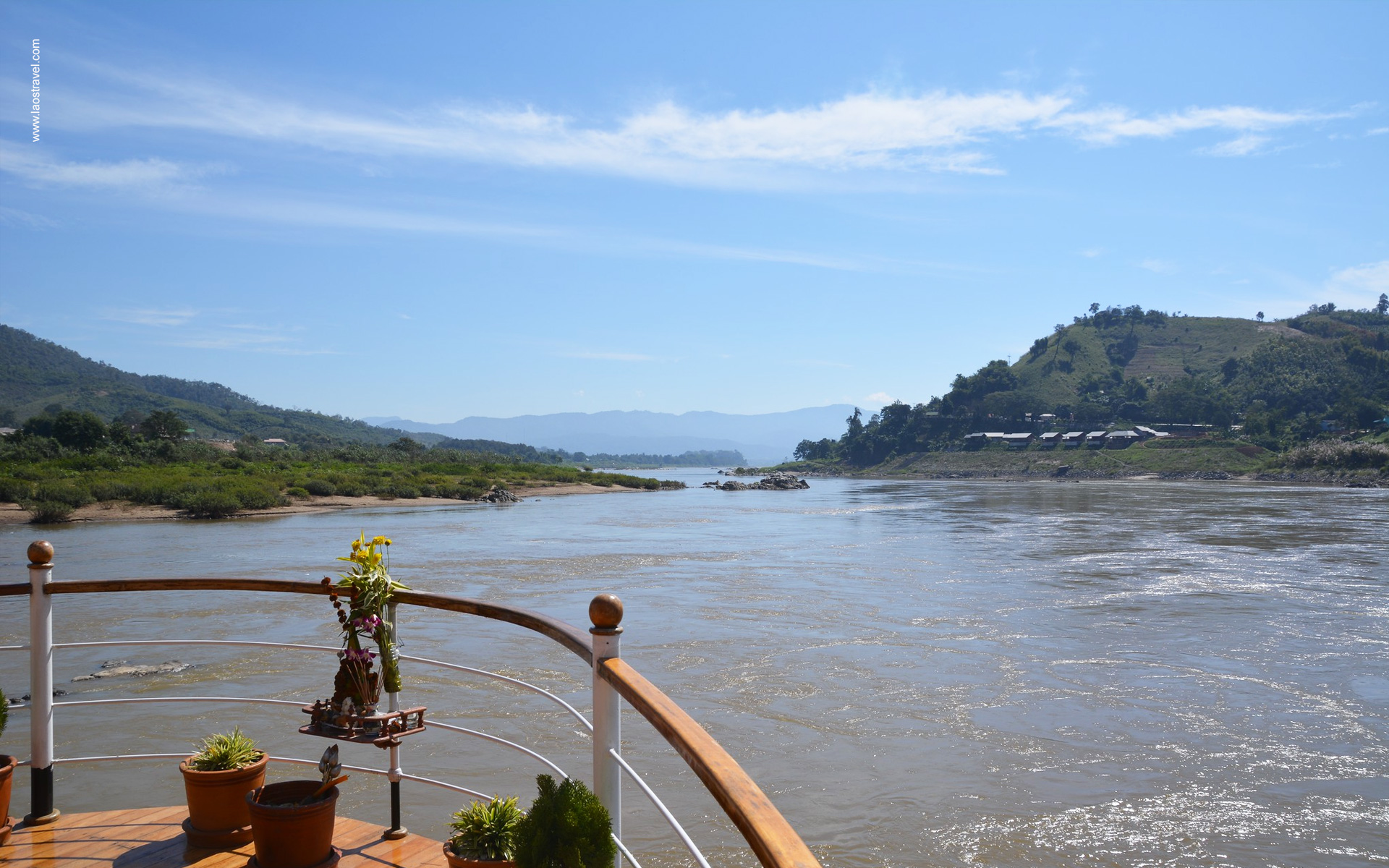 Boat trip on Mekong river with stunning view of surrounding mountains